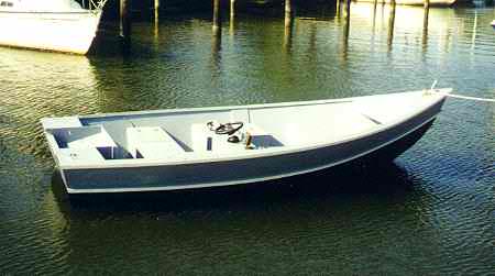 Wee Hunk. A 16' stitch and glue power dory with center console