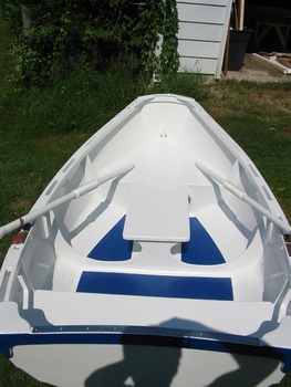 Non-skid blue inside. The fore & aft rowing seat is just great! 